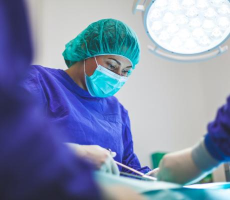 Woman wearing a green mask